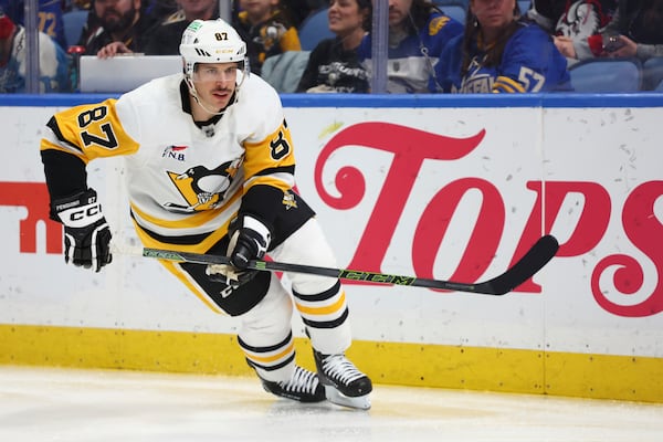 Pittsburgh Penguins center Sidney Crosby (87) skates behind the net during the second period of an NHL hockey game against the Buffalo Sabres Friday, Jan. 17, 2025, in Buffalo, N.Y. (AP Photo/Jeffrey T. Barnes)