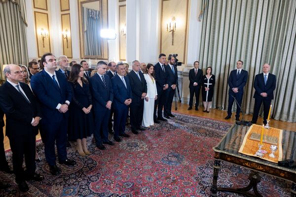 Greek President Konstantinos Tasoulas, right, and Prime Minister Kyriakos Mitsotakis attend a swearing in ceremony at the Presidential palace, in Athens, Greece, Saturday, March 15, 2025. (AP Photo/Yorgos Karahalis)