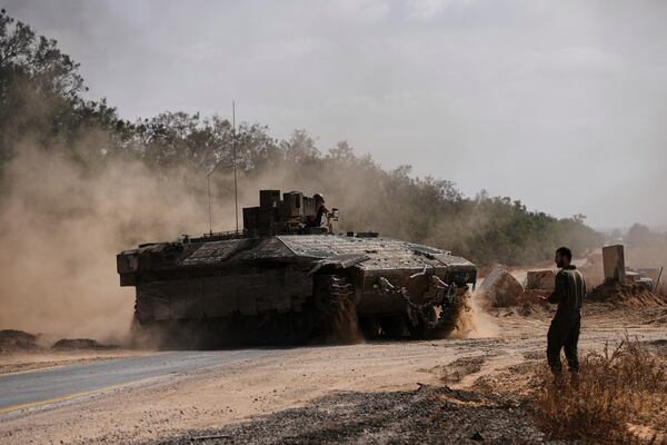 Israeli forces move along the border with the Gaza Strip, in southern Israel, Monday, May 19, 2025. (AP Photo/Ohad Zwigenberg)