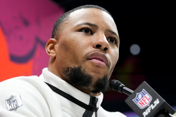 Philadelphia Eagles running back Saquon Barkley (26) participates during Super Bowl 59 Opening Night, Monday, Feb. 3, 2025, in New Orleans, ahead of the NFL football game between the Philadelphia Eagles and the Kansas City Chiefs Sunday. (AP Photo/Brynn Anderson )