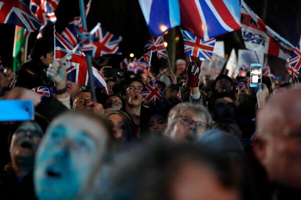 FILE - Brexit supporters celebrate during a rally in London, Friday, Jan. 31, 2020. Britain leaves the European Union after 47 years, leaping into an unknown future in historic blow to the bloc. (AP Photo/Frank Augstein, File)