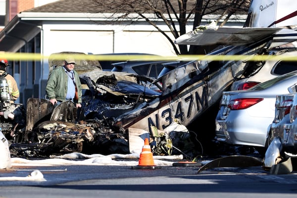 First responders work the scene after a plane crashed in a parking lot of a retirement community Sunday, March 9, 2025, in Manheim Township, Pa. (Zach Gleiter/The Patriot-News via AP)