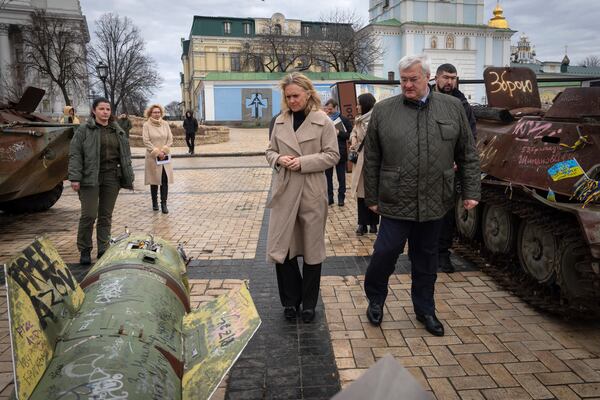 Iceland's Foreign Minister Thorgerdur Katrin Gunnarsdottir, left, and Ukraine's Foreign Minister Andriiy Sybiha look at fragments of Russian rocket in central Kyiv, Ukraine, Tuesday, Jan. 7, 2025. (AP Photo/Efrem Lukatsky)