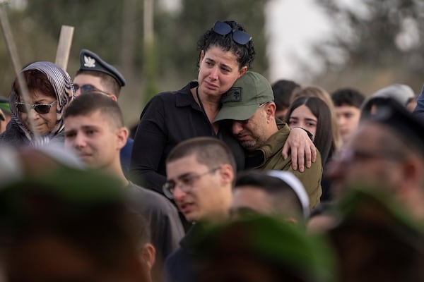 Mourners attend the funeral of Israeli soldier Sergeant Yahav Maayan who was killed in combat in the Gaza Strip, during his funeral at a military cemetery in Modiin, Israel, Sunday, Jan. 12, 2025. (AP Photo/Ohad Zwigenberg)