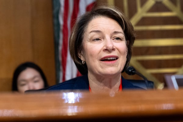 Senate Agriculture, Nutrition, and Forestry Committee Ranking Member Sen. Amy Klobuchar, D-Minn., speaks to Brooke Rollins during a committee hearing on Rollins' nomination for Secretary of Agriculture, Thursday, Jan. 23, 2025, in Washington. (AP Photo/Jacquelyn Martin)