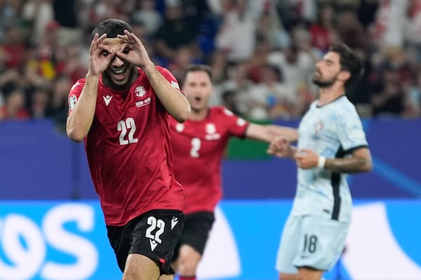 FILE - Georgia's Georges Mikautadze celebrates after scoring on a penalty kick during a Group F match between Georgia and Portugal at the Euro 2024 soccer tournament in Gelsenkirchen, Germany, Wednesday, June 26, 2024. (AP Photo/Martin Meissner, File)