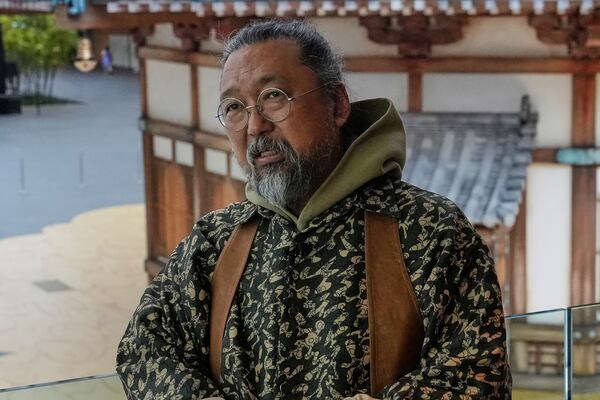 Artist Takashi Murakami is pictured during an interview in front of a true-to-scale recreation of the Yumedono from the Horyuji Temple complex in Nara, at the Cleveland Museum of Art in Cleveland, Thursday, May 15, 2025. (AP Photo/Sue Ogrocki)