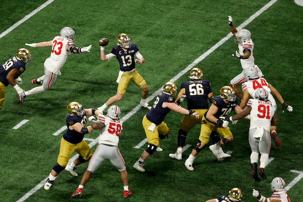 Notre Dame quarterback Riley Leonard passes against Ohio State during second half of the College Football Playoff national championship game Monday, Jan. 20, 2025, in Atlanta. (AP Photo/Butch Dill)