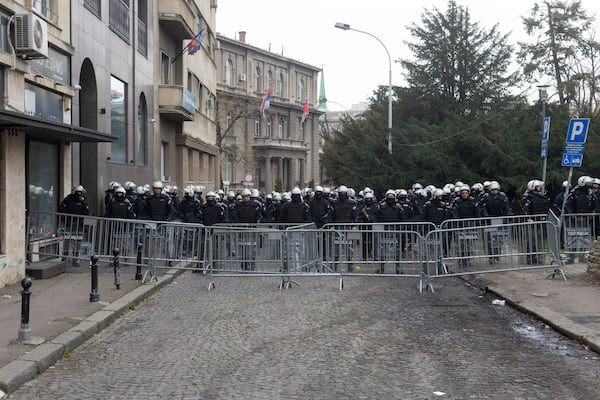 Police in riot gear cordon off a street in front of the office of the president of Serbia during a major anti-corruption rally led by university students in Belgrade, Serbia, Saturday, March 15, 2025. (AP Photo/Marko Drobnjakovic)