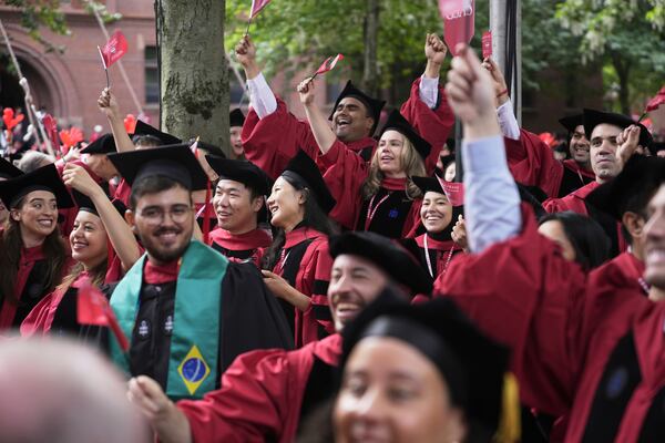 Students cheer during Harvard University's commencement ceremonies, Thursday, May 29, 2025 in Cambridge, Mass. (AP Photo/Charles Krupa)