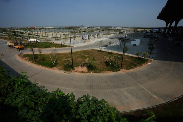 An overview from beside of parking in front an under construction of a new airport of Techo International Airport at the outskirts of Phnom Penh Cambodia, Friday, March 21, 2025. (AP Photo/Heng Sinith)