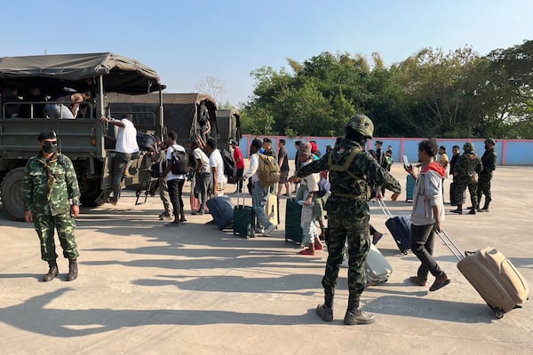 In this photo released by Royal Thai Army, more than 250 people from 20 nations who were reportedly rescued from alleged scam centers in Myanmar, as they crossed into Thailand's Tak province on Wednesday, Feb. 12, 2025. (Royal Thai Army, by Army Spokesperson via AP)