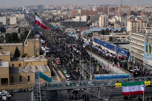 Iranians march during a rally commemorating anniversary of 1979 Islamic Revolution that toppled the late pro-U.S. Shah Mohammad Reza Pahlavi and brought Islamic clerics to power, in Tehran, Iran, Monday, Feb. 10, 2025. (AP Photo/Vahid Salemi)