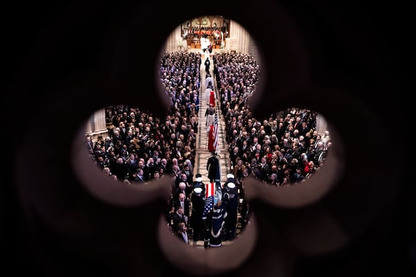 The casket of former President Jimmy Carter arrives for a state funeral at the National Cathedral, Thursday, Jan. 9, 2025, in Washington. (Haiyun Jiang/The New York Times via AP, Pool)