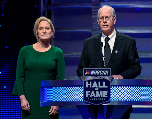 FILE - CEO and Chairman of NASCAR Jim France, right, along with the Executive Vice President of NASCAR Lesa Kennedy announce the Landmark Award to Edsel Ford II the Hall of Fame induction ceremony in Charlotte, N.C. Jan. 31, 2020. (AP Photo/Mike McCarn, File)