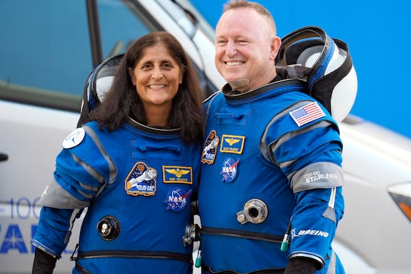 FILE - NASA astronauts Suni Williams, left, and Butch Wilmore stand together for a photo enroute to the launch pad at Space Launch Complex 41 Wednesday, June 5, 2024, in Cape Canaveral, Fla., for their liftoff on a Boeing Starliner capsule to the International Space Station. (AP Photo/Chris O'Meara, File)