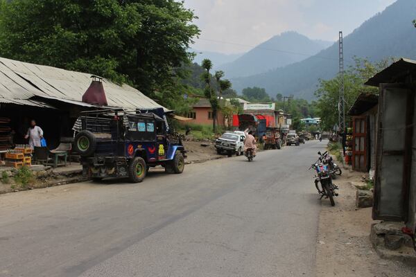 A motorcyclist drives through an empty market at a tourists point in Karen, in the Neelum Valley near on the Line of Control, the de facto border that divides the disputed region of Kashmir, some 93 kilometres (58 miles) from Muzaffarabad, the capital of Pakistan controlled Kashmir, Thursday, May 1, 2025. (AP Photo/Ishfaq Hussain)