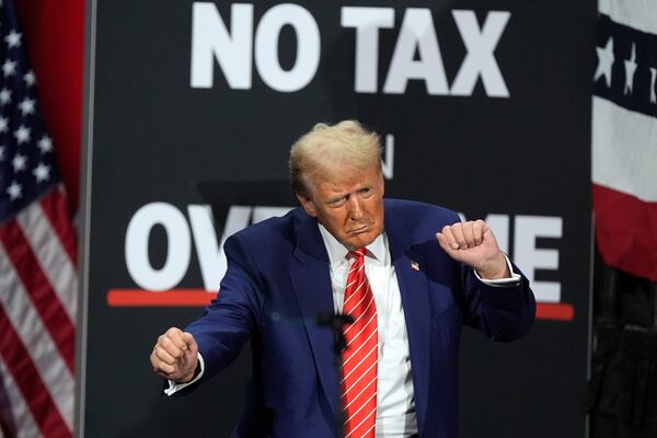 FILE - Republican presidential nominee former President Donald Trump dances at a campaign event at the Cobb Energy Performing Arts Centre, Oct. 15, 2024, in Atlanta. (AP Photo/John Bazemore, File)
