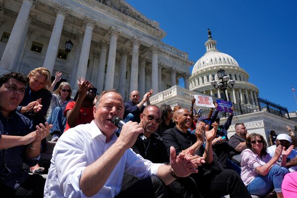 Sen. Adam Schiff, D-Calif., from left, speaks as House Minority Leader Hakeem Jeffries, D-N.Y., and Sen. Cory Booker D-N.J., listen during a live-streamed conversation on the steps of the Capitol, Sunday, April 27, 2025, in Washington. (AP Photo/Manuel Balce Ceneta)