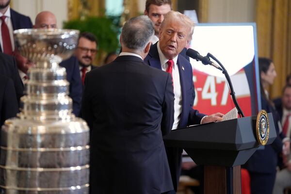 President Donald Trump speaks as Vincent Viola, team owner of the 2024 NHL Stanley Cup champion Florida Panthers hockey team, left, listens during a ceremony to honor the team in the East Room of the White House, Monday, Feb. 3, 2025, in Washington. (AP Photo/Evan Vucci)