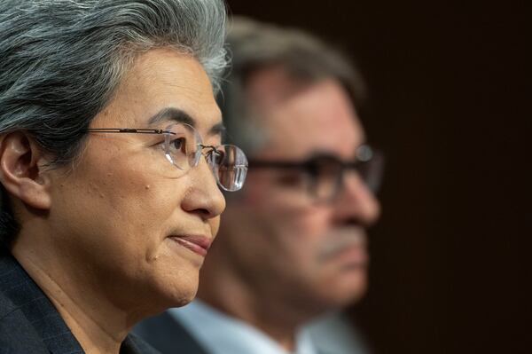 Dr. Lisa Su, chief executive officer and chair, Advanced Micro Devices (AMD), left, and Michael Intrator, co-founder and chief executive officer, CoreWeave, take part in a hearing before the Senate Committee on Commerce, Science, and Transportation, Thursday, May 8, 2025, in Washington. (AP Photo/Kevin Wolf)