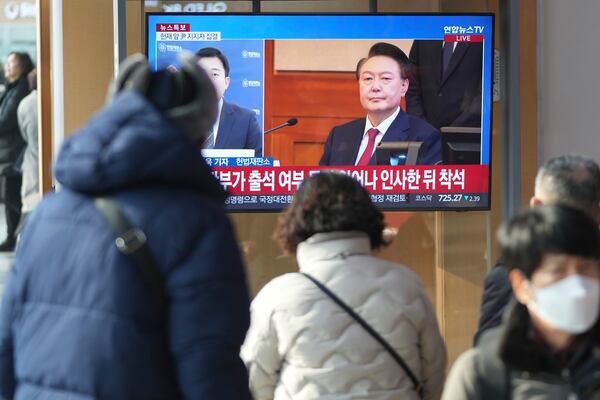 A TV screen shows footage of impeached South Korean President Yoon Suk Yeol during a news program at the Seoul Railway Station in Seoul, South Korea, Tuesday, Jan. 21, 2025. (AP Photo/Lee Jin-man)