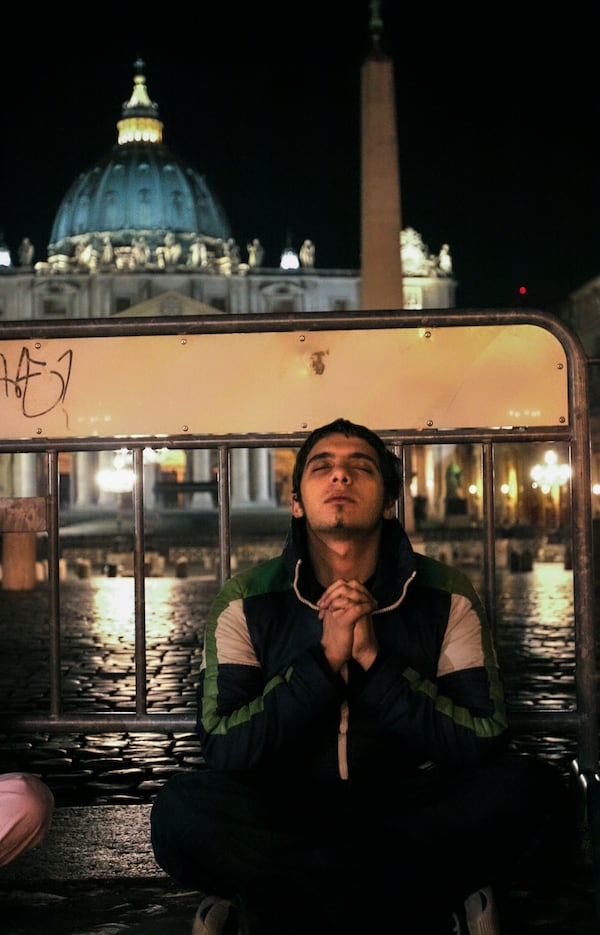 FILE- Connor Power from Brisbane, Australia, prays in St. Peter's square at the Vatican early Friday, April 1, 2005, for the health of Pope John Paul II. (AP Photo/Alessandra Tarantino, File)