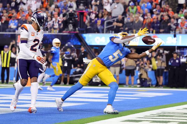 Los Angeles Chargers wide receiver Joshua Palmer (5) catches the ball in the end zone for a two-point conversion during the second half an NFL football game against the Denver Broncos, Thursday, Dec. 19, 2024, in Inglewood, Calif. (AP Photo/Ryan Sun)