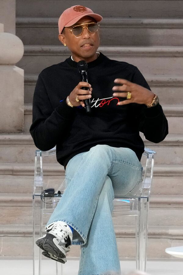 Musician and fashion designer Pharrell Williams speaks on a panel at the Grand Palais during the Artificial Intelligence Action Summit in Paris, Tuesday, Feb. 11, 2025. (AP Photo/Michel Euler)