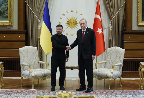 In this handout photo released by Turkish Presidency, Turkish President Recep Tayyip Erdogan, right, shakes hands with his Ukrainian counterpart Volodymyr Zelenskyy during their meeting at the Presidential palace in Ankara, Thursday, May 15, 2025. (Turkish Presidency via AP)