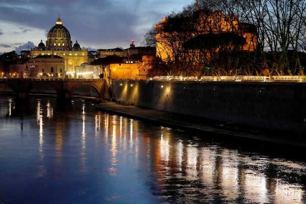 St Peter's Basilica at The Vatican at dusk across the river Tiber in Rome, Italy Friday, Feb. 28, 2025. (AP Photo/Kirsty Wigglesworth)