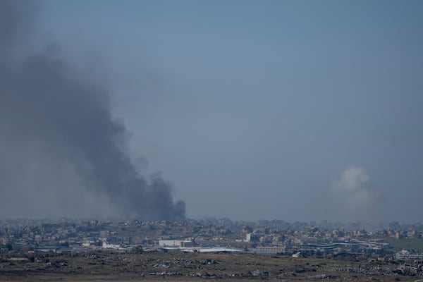 Smoke rises following an explosion in the Gaza Strip as seen from southern Israel, Wednesday, Jan. 1, 2025.(AP Photo/Ohad Zwigenberg)