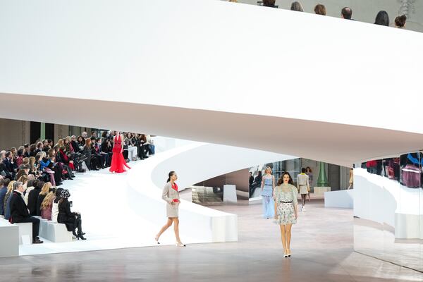 Models wear creations as part of the Chanel Haute Couture Spring Summer 2025 collection, that was presented in Paris, Tuesday, Jan. 28, 2025. (AP Photo/Lewis Joly).