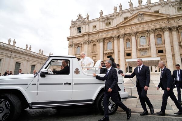 Pope Leo XIV leaves after his first weekly general audience in St. Peter's Square at The Vatican, Wednesday, May 21, 2025. (AP Photo/Gregorio Borgia)