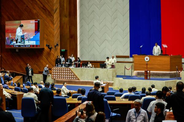 House Speaker Martin Romualdez, top right, presides over the impeachment proceedings against Vice President Sara Duterte at the House of Representatives in Quezon City in Manila, Philippines, Wednesday, Feb.5, 2025. (AP Photo/Gerard Carreon)