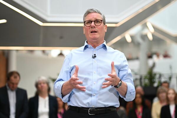 Britain's Prime Minister Keir Starmer gestures during a Q&A session after delivering a speech on plans to reform the civil service, during a visit to Reckitt Benckiser Health Care UK Ltd in Kingston upon Hull, England, Thursday, March 13, 2025. (Oli Scarff/Pool Photo via AP)