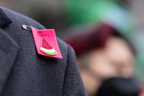 A person wearing a watermelon badge on their shoulder in Foley Square, outside the Manhattan federal court, in support of Mahmoud Khalil, Wednesday, March 12, 2025, in New York. (AP Photo/Stefan Jeremiah)