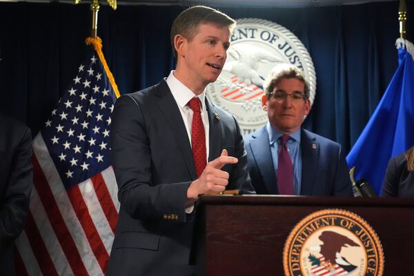 Christopher R. Kavanaugh, the United States Attorney for the Western District of Virginia, gestures while announcing that the McKinsey & Company agreed to pay $650 million for helping Purdue Pharma boost opioid sales during a news conference at the Moakley Federal Courthouse, Friday, Dec. 13, 2024, in Boston. At right is Joshua S. Levy, the United States Attorney for the District of Massachusetts. (AP Photo/Charles Krupa)