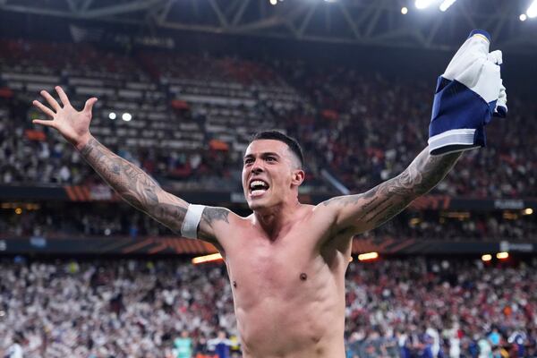 Tottenham's Pedro Porro celebrates after winning the Europa League final soccer match against Manchester United at the San Mames Stadium in Bilbao, Spain, Wednesday, May 21, 2025. (AP Photo/Jose Breton)