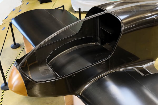 The Climate Impulse, a plane powered by liquid hydrogen, is displayed at a hangar in Les Sables d'Olonne, France on Thursday, Feb. 13, 2025. (AP Photo/Yohan Bonnet)