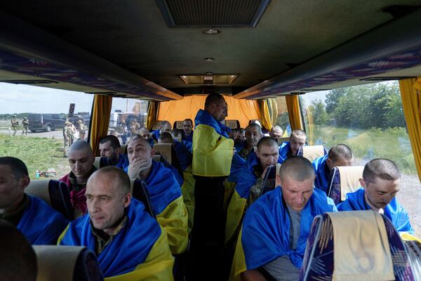 FILE - Ukrainian soldiers sit in a bus in the Sumy region of Ukraine after returning from captivity in Russia, May 31, 2024. (AP Photo/Evgeniy Maloletka, File)