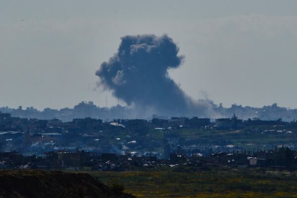 Smoke rises to the sky after an explosion in the Gaza Strip as seen from southern Israel, Sunday, March 23, 2025. (AP Photo/Leo Correa)