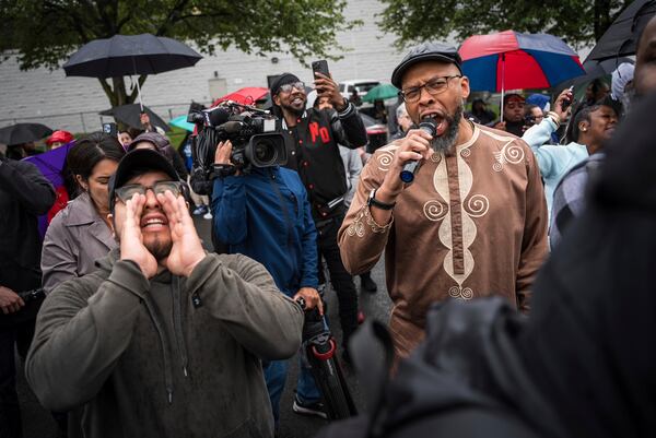 Protestors shout "Let him out" to demand the release of Newark Mayor Ras Baraka after his arrest while protesting outside an ICE detention prison, Friday, May 9, 2025, in Newark, N.J, (AP Photo/Angelina Katsanis)