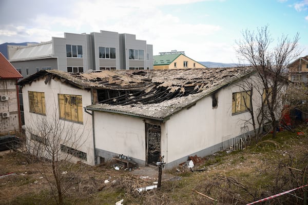 The building of a nightclub is damaged following a massive fire early Sunday in the town of Kocani, North Macedonia, Monday, March 17, 2025, (AP Photo/Armin Durgut)