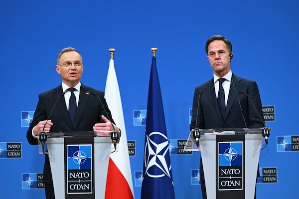 Poland's President Andrej Duda, left, and NATO Secretary General Mark Rutte address a media conference at NATO headquarters in Brussels, Thursday, March 6, 2025. (AP Photo/Harry Nakos)