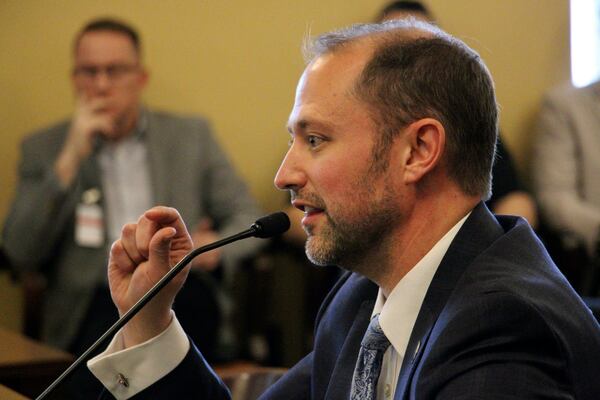 Utah state Rep. Jordan Teuscher, a South Jordan Republican, presents his bill seeking to end public sector collective bargaining, Thursday, Jan. 23, 2025, at the Capitol Building in Salt Lake City. (AP Photo/Hannah Schoenbaum)