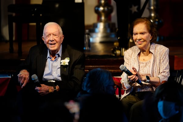 FILE - Former President Jimmy Carter, left, and his wife, former first lady Rosalynn Carter, sit together during a reception to celebrate their 75th anniversary, July 10, 2021, in Plains, Ga. (AP Photo/John Bazemore, Pool, File)