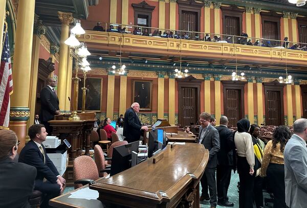 Democratic Speaker Joe Tate, top left, presides over the Michigan House of Representatives in Lansing, Mich., Thursday, Dec. 19, 2024. (AP Photo/Isabella Volmert)