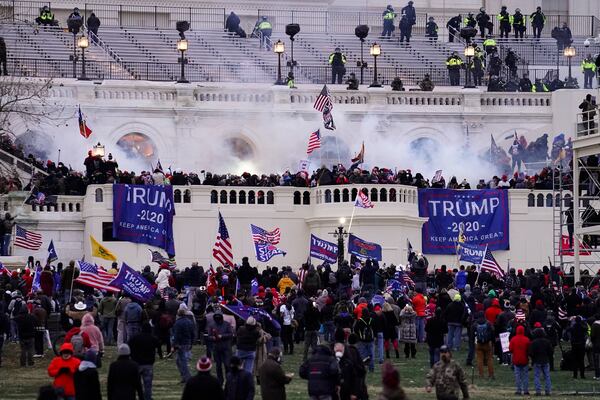 FILE - Violent rioters, loyal to President Donald Trump, storm the Capitol in Washington, Jan. 6, 2021. (AP Photo/John Minchillo, File)