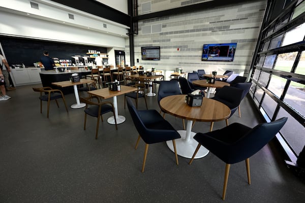 Members of the media check out a dining area next to the New York Yankees clubhouse kitchen during a tour of the upgraded team spring training facilities Thursday, Feb. 13, 2025, at George M. Steinbrenner Field in Tampa, Fla. (AP Photo/Steve Nesius)